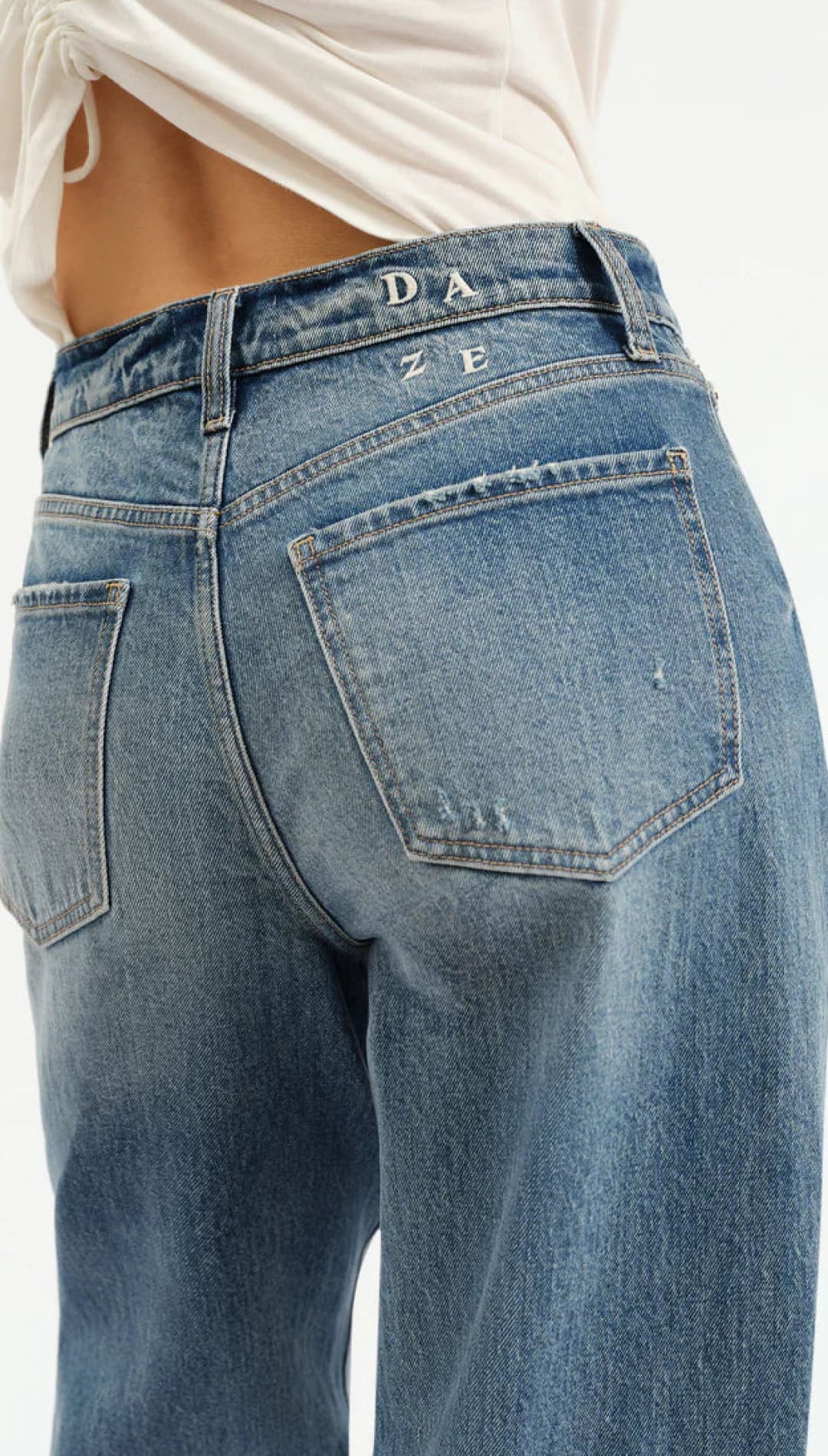 Light blue, distressed women’s denim jeans.