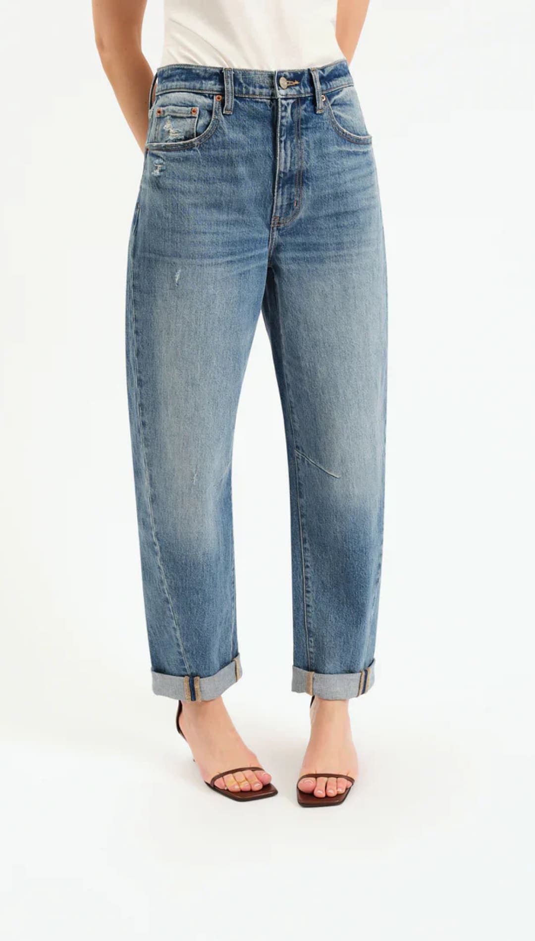 Women’s medium wash, distressed, high-waisted, cuffed, wide-leg jeans.