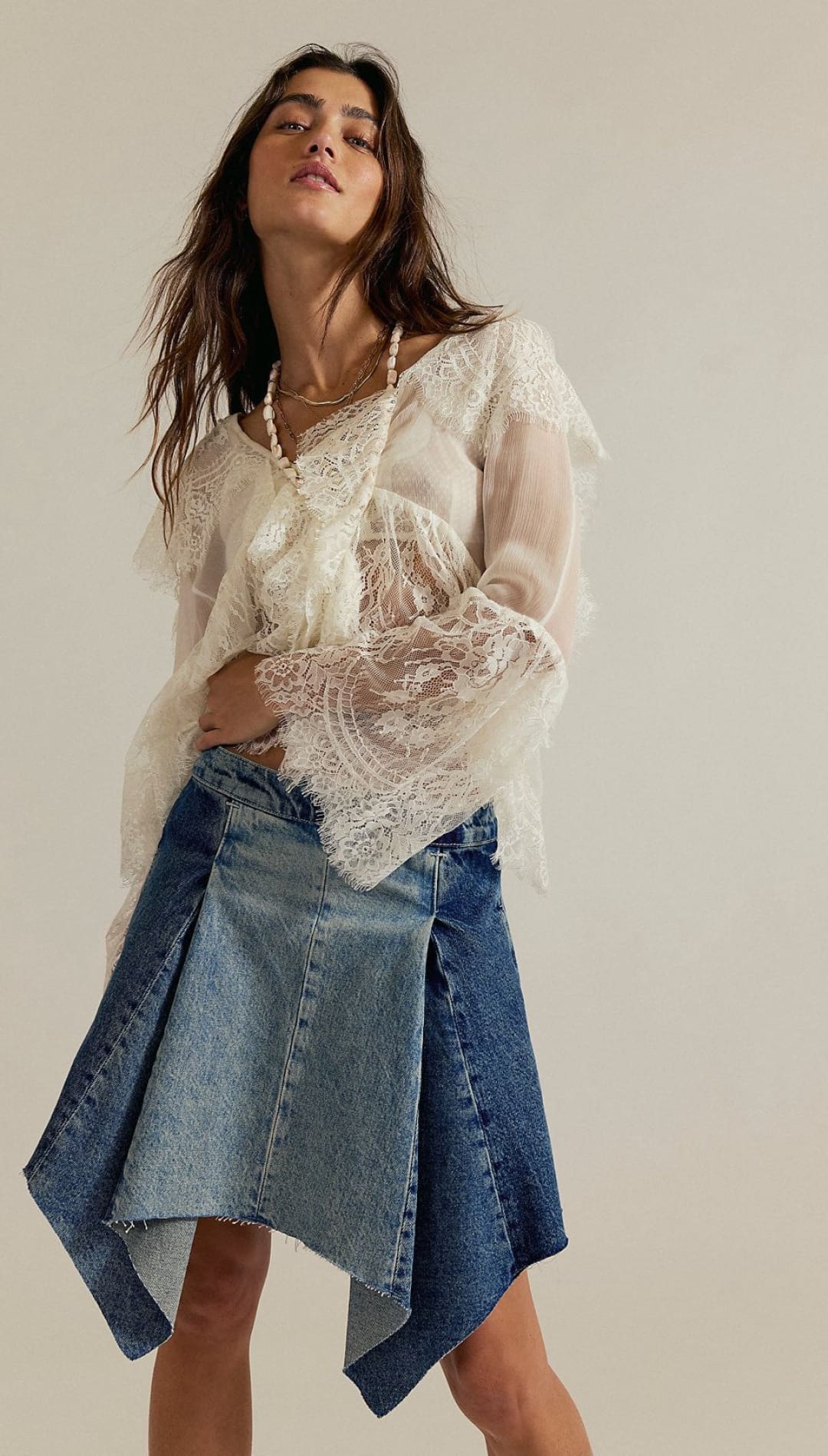Woman’s lace blouse and denim skirt.