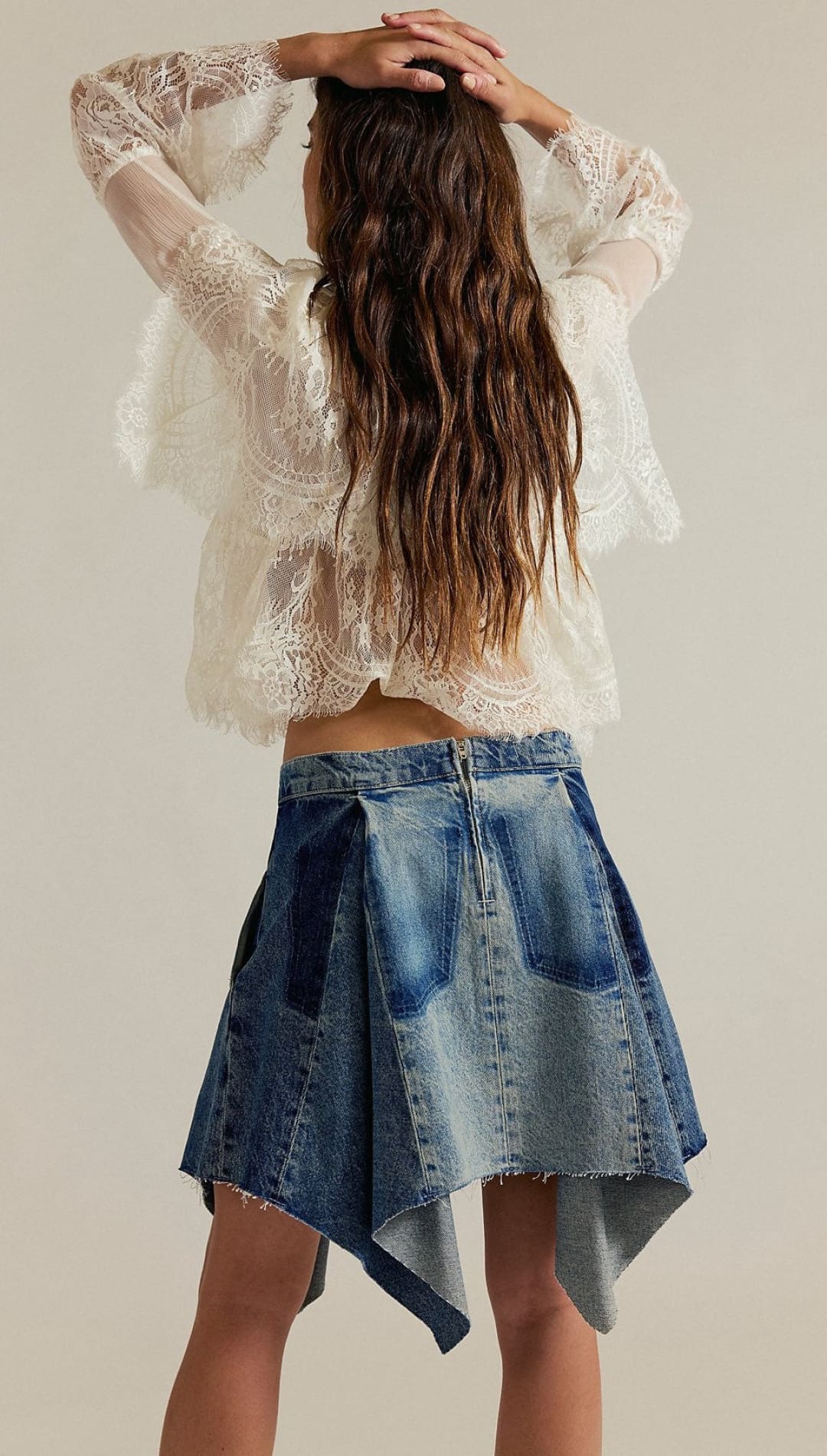 Woman’s lace top and denim skirt.