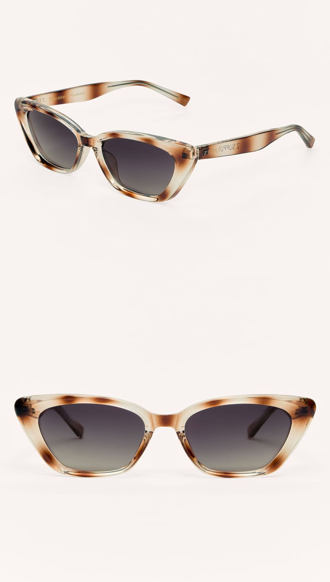 Cat-eye sunglasses with a translucent, light brown tortoise shell pattern and dark gradient lenses.