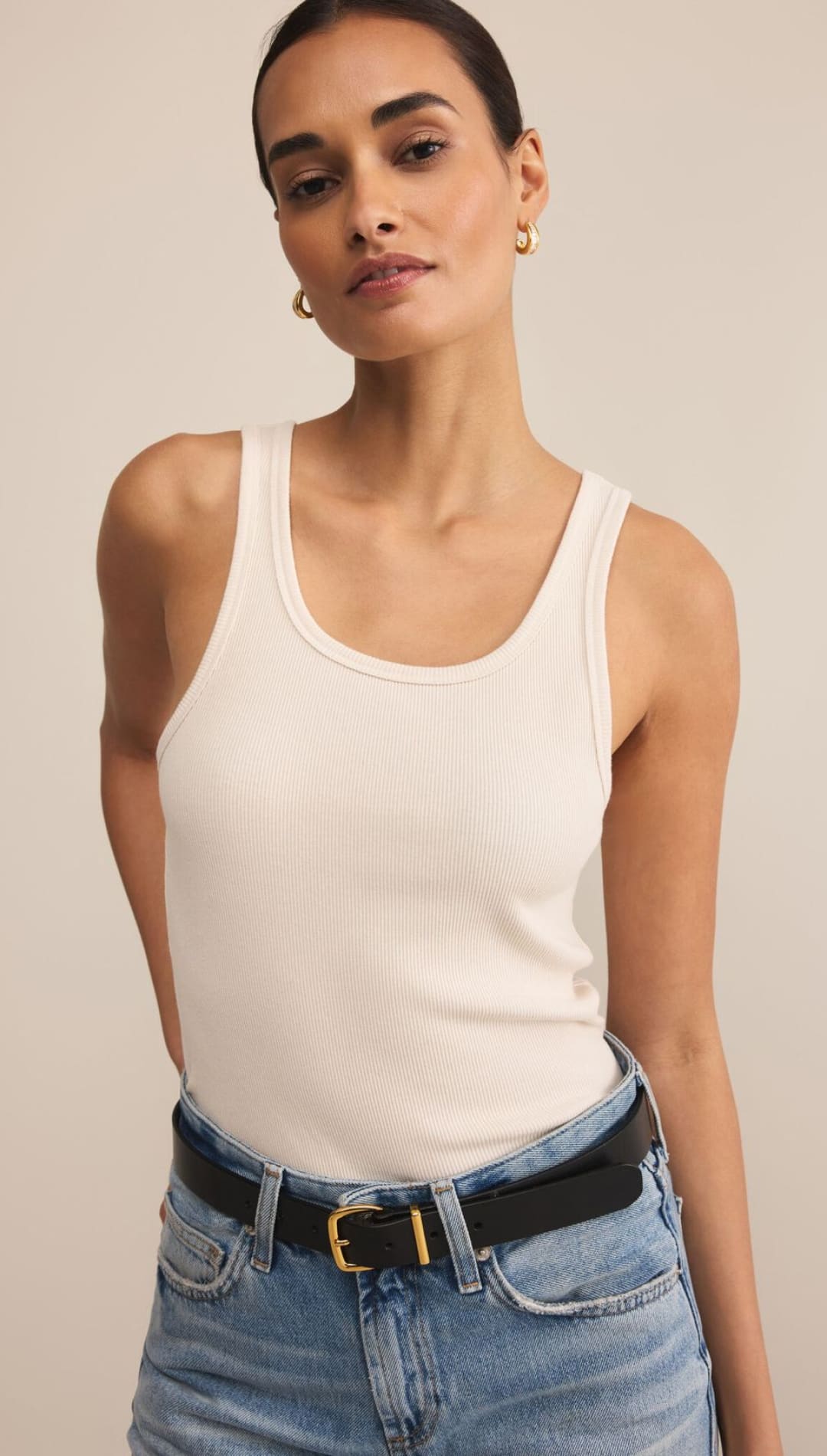 Ribbed white tank top with a scoop neck.