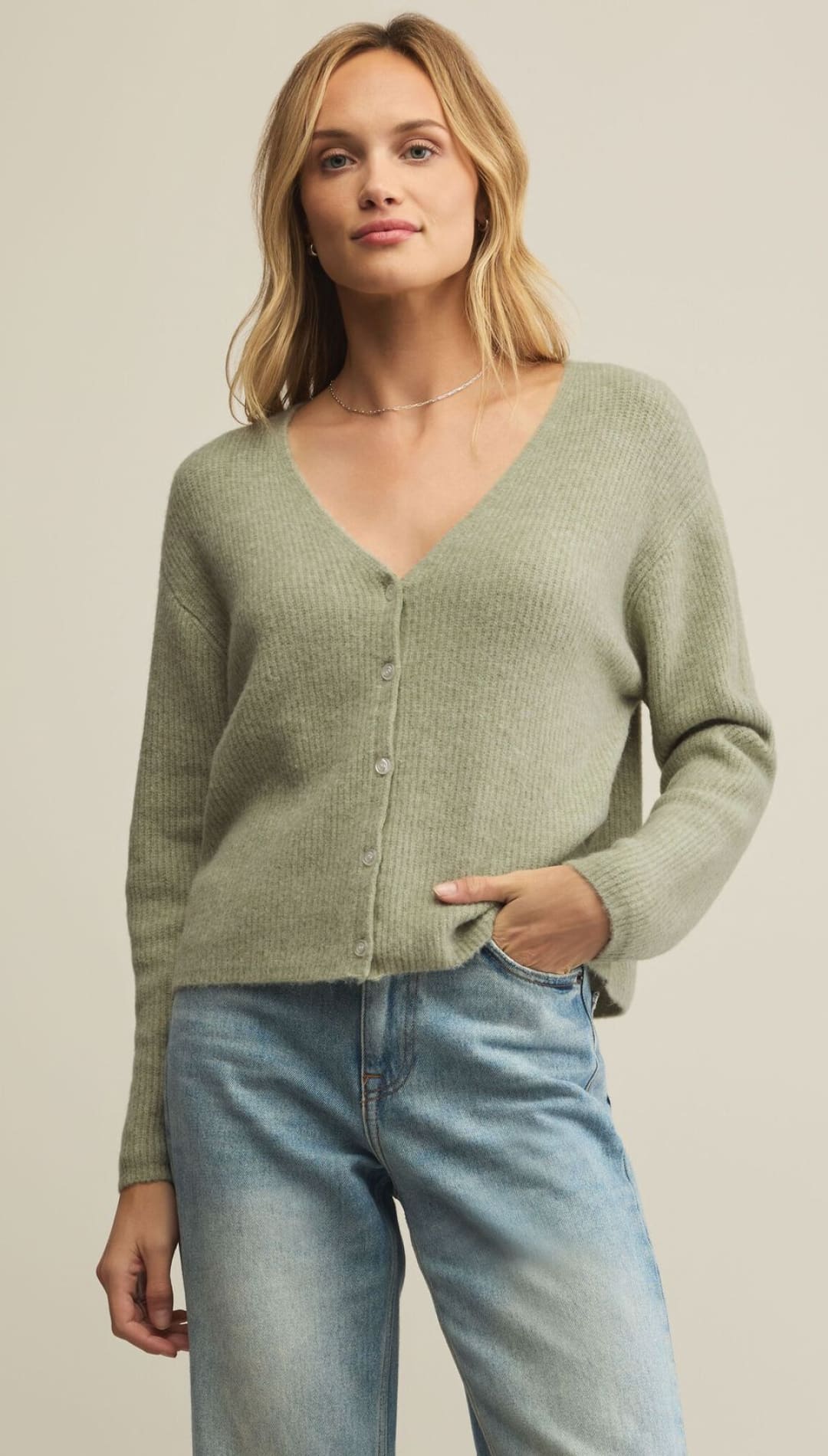 A light green button-front cardigan with a V-neck and long sleeves.