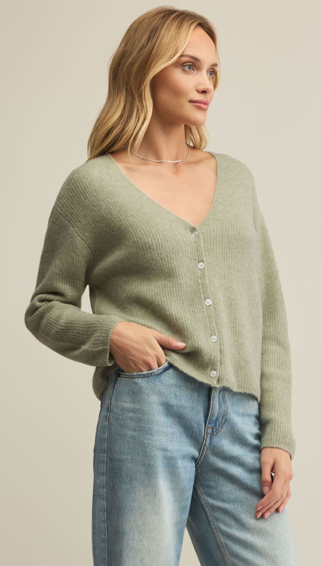 Women’s light green V-neck button-up cardigan.