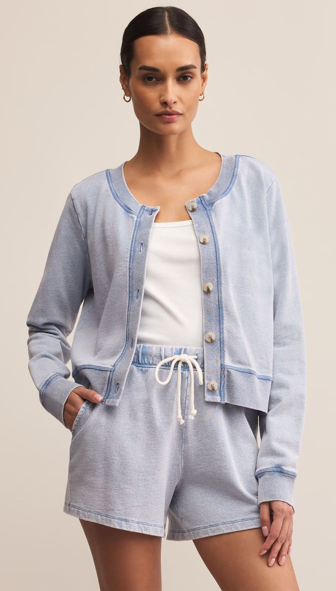 Light blue washed denim-look sweatshirt jacket and shorts set.