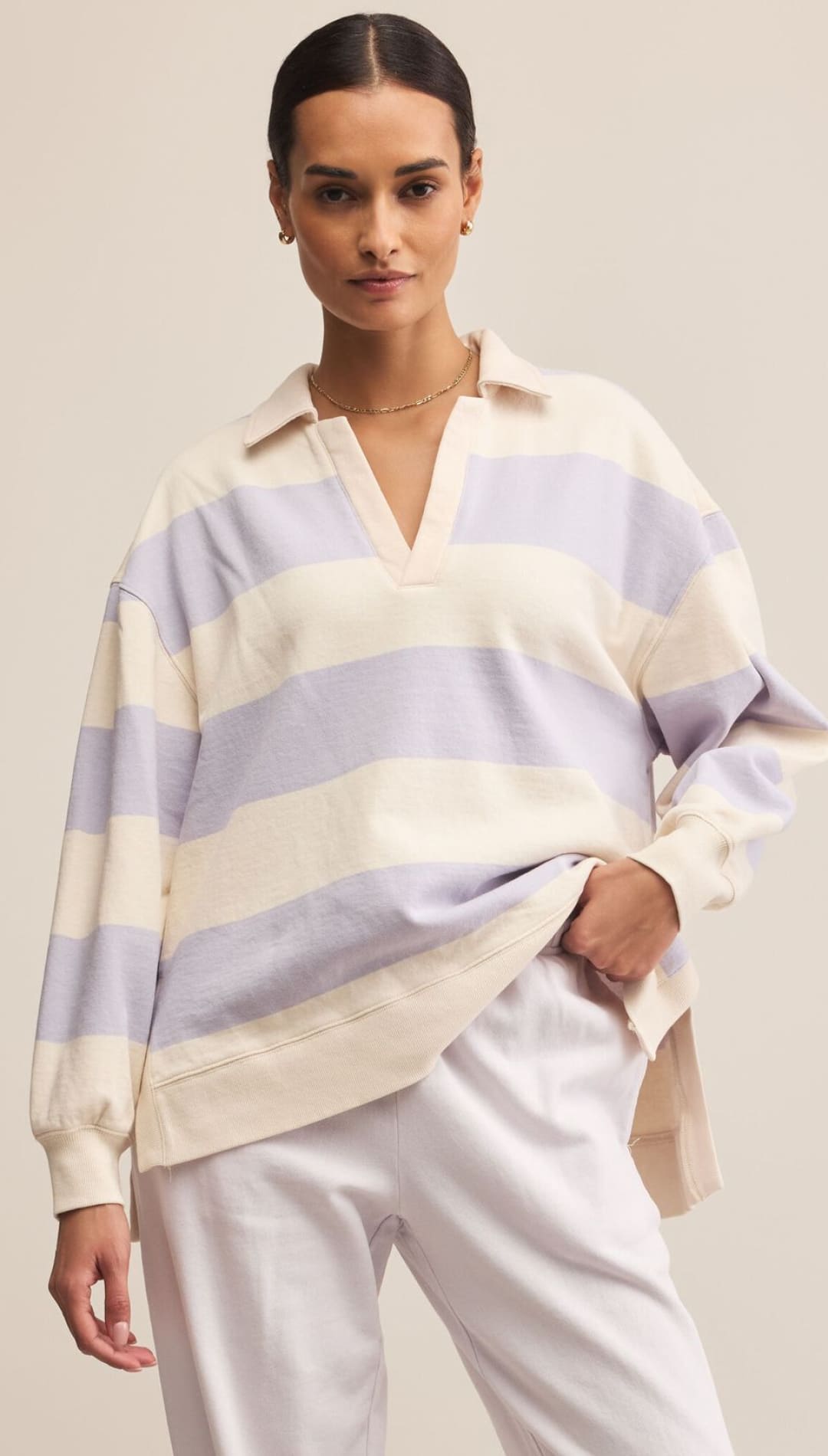 Women’s oversized striped long-sleeve polo shirt.