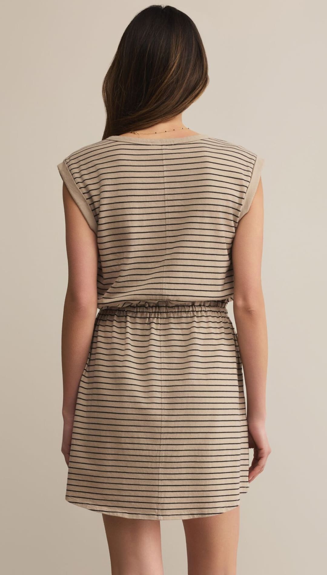 Beige and black striped sleeveless mini dress with an elasticated waist.