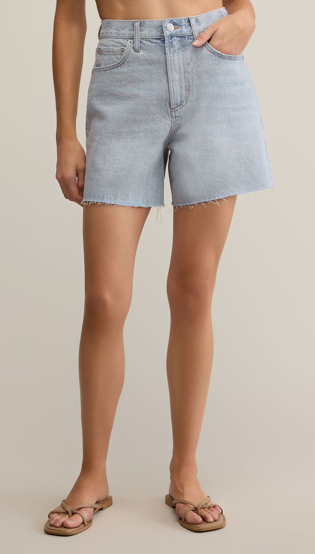 Light blue denim shorts with a raw hem.