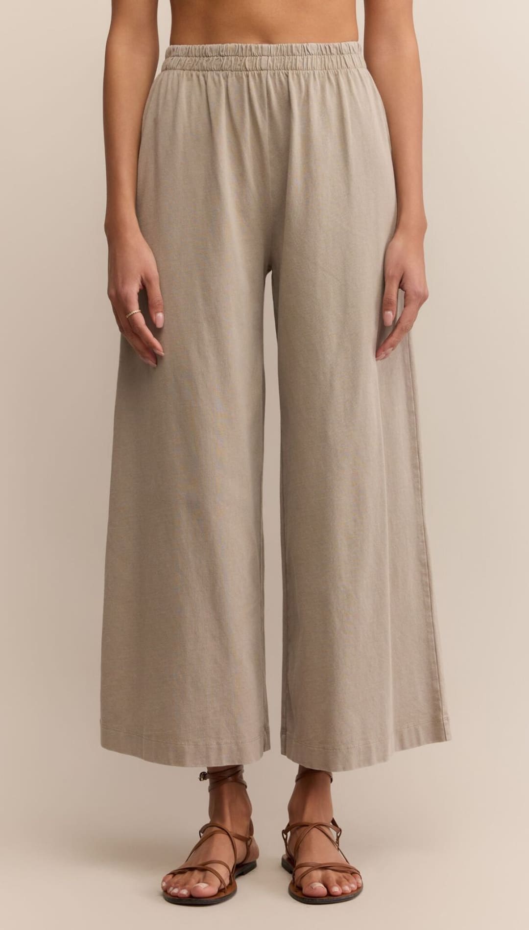 Women’s beige wide-leg cropped pants with an elastic waistband.