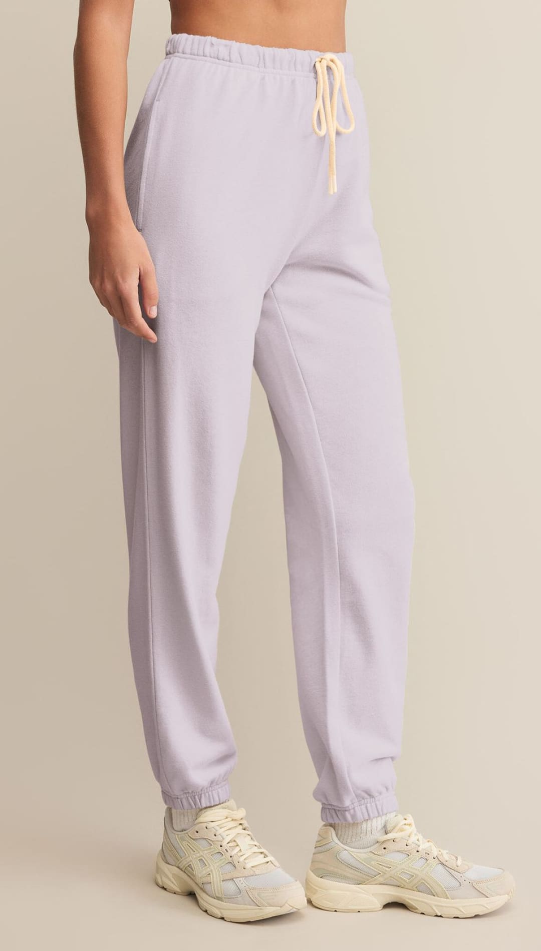 Light purple drawstring sweatpants with elasticated cuffs.