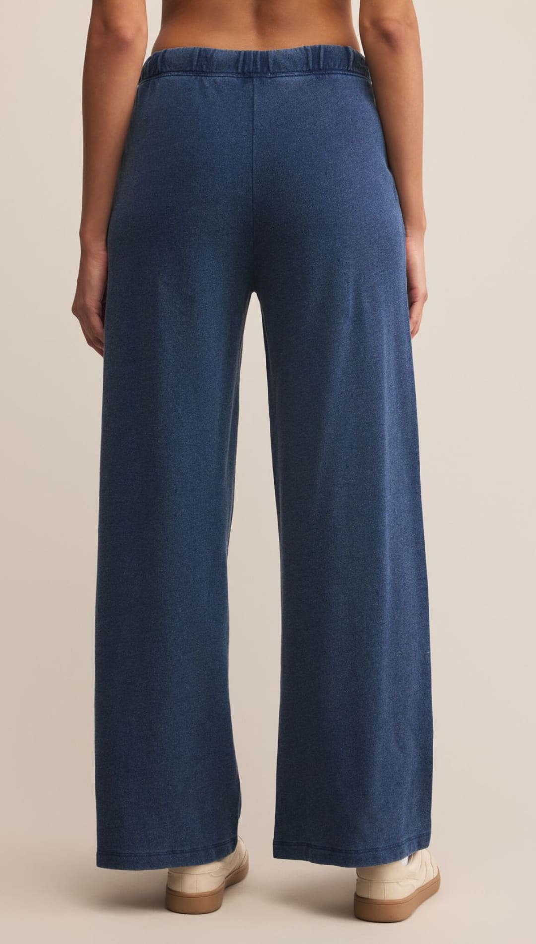 Women’s wide-leg navy blue sweatpants with an elastic waistband.